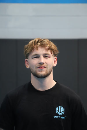 Rory, MMA Coach at Unity MMA with competitive kickboxing background